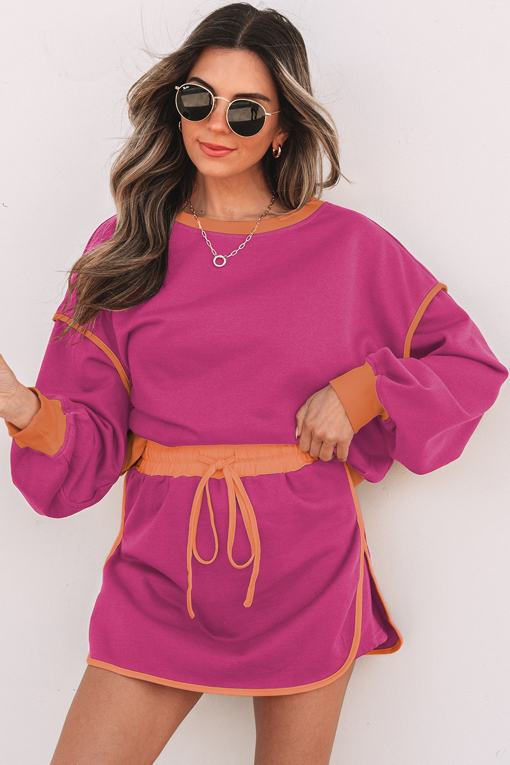 99132841-157ced4089f9c153.jpg Rose Red Color Contrast Loose Pullover and Lace-up Waist Skort Set - Image 1
