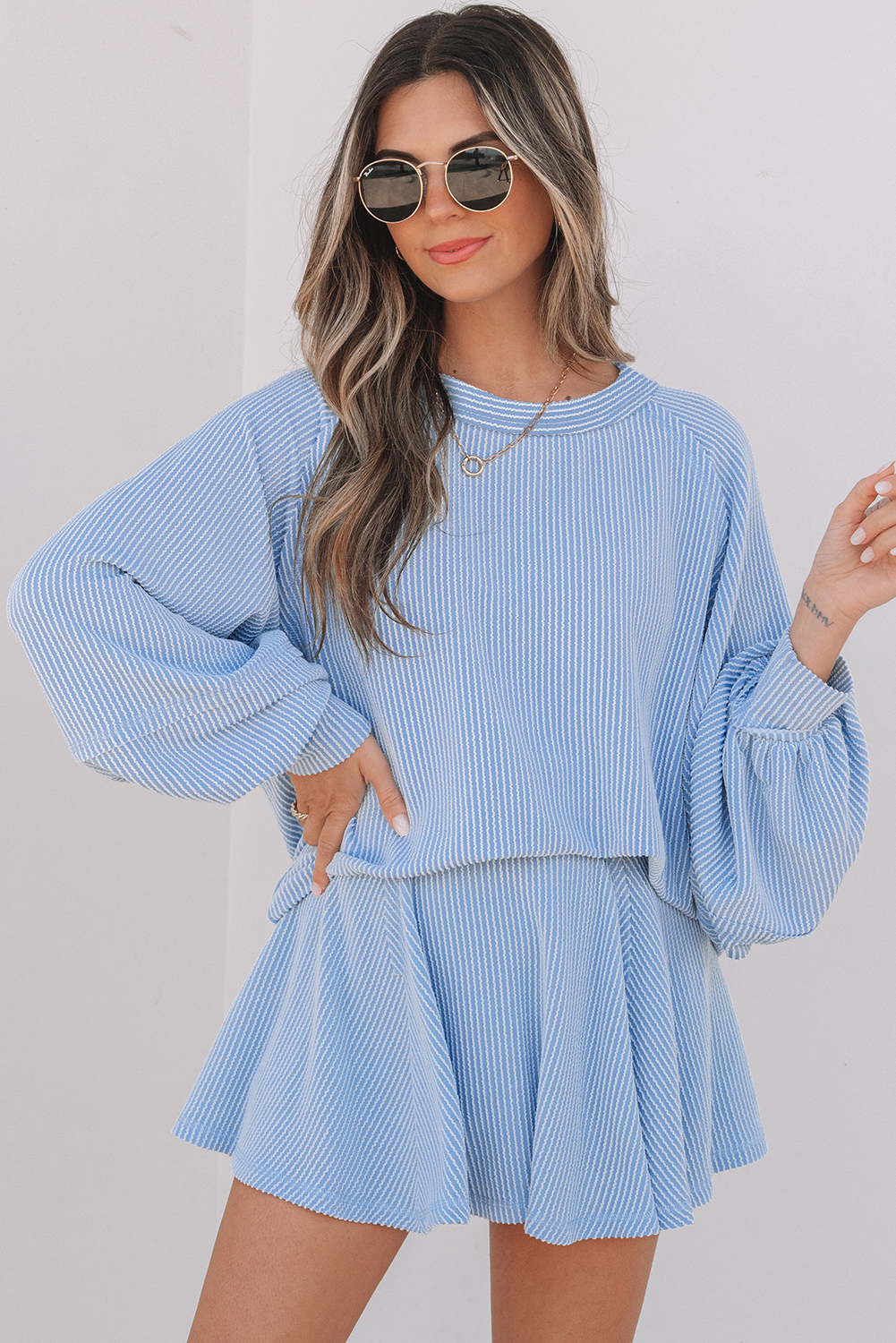 99132691-f07ee1515862235a.jpg Sky Blue Corded Lantern Sleeve Top High Waist Ruffled Mini Skort Set - Image 1